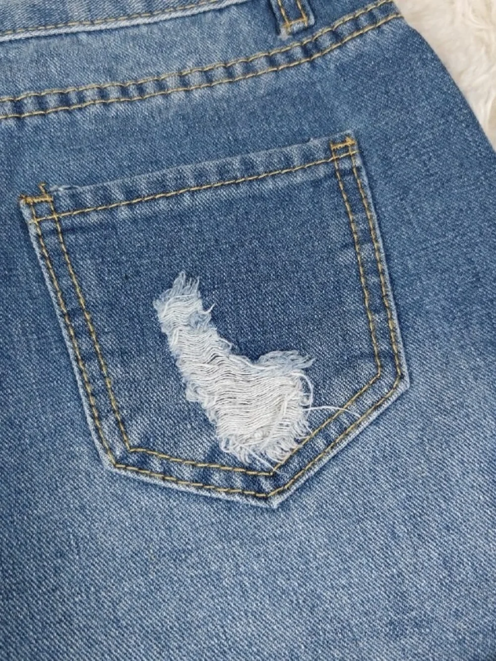 Distressed Blue Denim Shorts with Champion Patch